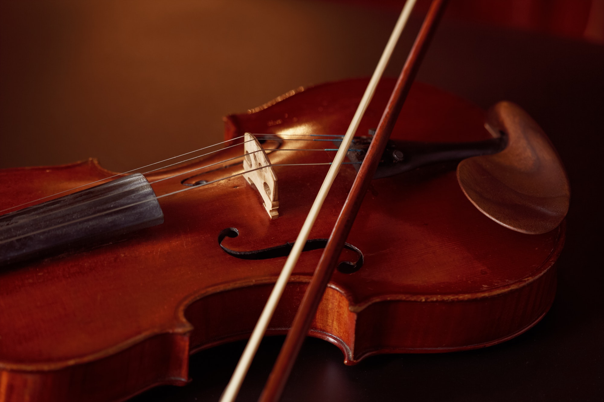Violin in retro style and bow, closeup view